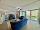 Wide view of the living room with furniture and balcony at 1390 Gulf Blvd # 104, Clearwater, FL 33767