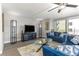 Living room with modern furniture, and a balcony at 1390 Gulf Blvd # 104, Clearwater, FL 33767