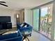 Relaxing living room with a view of the ocean and a private balcony with comfortable seating at 1390 Gulf Blvd # 104, Clearwater, FL 33767