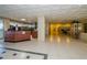 Spacious lobby area with a reception desk, tile flooring, and decorative elements at 1390 Gulf Blvd # 104, Clearwater, FL 33767