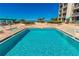 Resort style pool with lounge chairs and beach access at this wonderful property at 1390 Gulf Blvd # 104, Clearwater, FL 33767