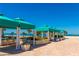 Poolside lounging areas with shaded cabanas and ocean views at this exclusive property at 1390 Gulf Blvd # 104, Clearwater, FL 33767