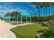 Putting green with manicured turf, beach access, and cabana at this amazing property at 1390 Gulf Blvd # 104, Clearwater, FL 33767