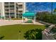 Putting green with manicured turf, beach access, and cabana at this amazing property at 1390 Gulf Blvd # 104, Clearwater, FL 33767