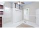 Bright bedroom features a blue ceiling, wood floors, and built-in closet at 14006 5Th St, Dade City, FL 33525