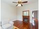 Living room with hardwood floors, fireplace, and comfortable seating, creating a cozy atmosphere at 14006 5Th St, Dade City, FL 33525