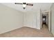 The bedroom features neutral colors, ceiling fan, and closet space at 1421 Normandy Park Dr # 6, Clearwater, FL 33756