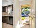 View of the kitchen from the entryway featuring stainless appliances and ample counter space at 1421 Normandy Park Dr # 6, Clearwater, FL 33756