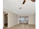 Spacious living room with ceiling fan and neutral walls and flooring at 1421 Normandy Park Dr # 6, Clearwater, FL 33756