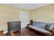 Bedroom displaying a futon couch, dresser, and closet with sleek wood floors at 147 Bluff View Dr # 206, Belleair Bluffs, FL 33770