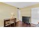 Bedroom with wooden floors with a desk, dresser, and doorway in view at 147 Bluff View Dr # 206, Belleair Bluffs, FL 33770