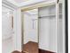 A mirrored closet features ample storage and easy access to the bathroom, providing functionality and style at 147 Bluff View Dr # 206, Belleair Bluffs, FL 33770