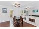 Cozy dining area featuring hardwood floors, stylish furnishings, and easy access to the kitchen at 147 Bluff View Dr # 206, Belleair Bluffs, FL 33770