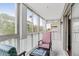 A cozy sunroom patio with large windows, comfortable seating, and plenty of natural light create a relaxing retreat at 147 Bluff View Dr # 206, Belleair Bluffs, FL 33770