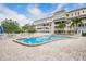 Beautiful, sparkling pool with lots of space for lounge chairs at 147 Bluff View Dr # 206, Belleair Bluffs, FL 33770