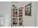 Cozy reading nook with a floor-to-ceiling bookcase at 147 Bluff View Dr # 206, Belleair Bluffs, FL 33770