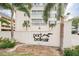 Exterior shot showcasing the 'Port Belleair' sign, signaling the entrance to a well-maintained residential complex at 147 Bluff View Dr # 206, Belleair Bluffs, FL 33770