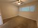 Bright bedroom with neutral walls, window with blinds, ceiling fan and carpet at 212 S Church Ave # 105, Tampa, FL 33609
