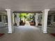 Parking garage with lush greenery and walkway to courtyard at 212 S Church Ave # 105, Tampa, FL 33609