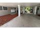 Spacious carport with mailboxes and walkway to courtyard at 212 S Church Ave # 105, Tampa, FL 33609