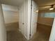 Hallway leading to the bedroom, featuring neutral paint and smooth floors at 212 S Church Ave # 105, Tampa, FL 33609