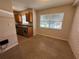 Efficient kitchen featuring granite countertops, wood cabinets, stainless appliances, and natural light at 212 S Church Ave # 105, Tampa, FL 33609
