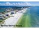 Breathtaking aerial view of #1 rated St. Pete Beach with white sand, turquoise water, and clear skies at 217 50Th N Ter, St Petersburg, FL 33703