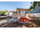Backyard view with a boat and trailer, access to buildings, and steps at 217 50Th N Ter, St Petersburg, FL 33703