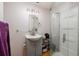 Bathroom featuring a modern vanity, mirror, lighting, and a glass-enclosed shower at 217 50Th N Ter, St Petersburg, FL 33703