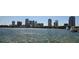 Breathtaking waterfront view with a modern city skyline, calm waters, and boats docked along the shore at 217 50Th N Ter, St Petersburg, FL 33703