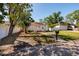 Inviting single-story home with fresh exterior, a charming walkway, and a well-maintained front yard at 217 50Th N Ter, St Petersburg, FL 33703