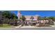 Exterior view of a grand pink hotel with beautiful landscaping, palm trees, and a well-maintained entrance at 217 50Th N Ter, St Petersburg, FL 33703