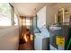 Functional laundry room with stacked washer/dryer and water heater at 217 50Th N Ter, St Petersburg, FL 33703