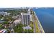 An aerial view highlights the waterfront property and multiple building amenities at 2413 Bayshore Blvd # 605, Tampa, FL 33629