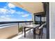Enjoy stunning ocean views from the balcony with comfortable seating and dining table at 2413 Bayshore Blvd # 605, Tampa, FL 33629