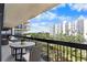 Relax on the spacious balcony overlooking lush greenery with a table and comfortable seating at 2413 Bayshore Blvd # 605, Tampa, FL 33629