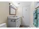 Bathroom featuring a granite countertop, updated vanity, new fixtures and a tile floor at 2413 Bayshore Blvd # 605, Tampa, FL 33629