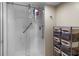 Updated bathroom with glass enclosed shower, storage shelves, and modern fixtures at 2413 Bayshore Blvd # 605, Tampa, FL 33629