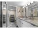 Stylish bathroom featuring granite countertops, double sinks, and updated vanity with modern lighting at 2413 Bayshore Blvd # 605, Tampa, FL 33629