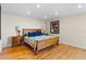 Bedroom with wooden flooring, a wooden bed frame, and lots of natural light from recessed ceiling fixtures at 2413 Bayshore Blvd # 605, Tampa, FL 33629