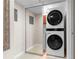 A laundry area is shown with a stacked washer and dryer, providing in-unit convenience at 2413 Bayshore Blvd # 605, Tampa, FL 33629