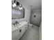 Nicely updated bathroom with stand-up shower, modern fixtures, and a new vanity at 2527 13Th S Ave, St Petersburg, FL 33701