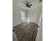 The bedroom features modern flooring, a ceiling fan and a bright window at 2527 13Th S Ave, St Petersburg, FL 33701