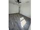 Bright bedroom featuring modern flooring, a ceiling fan, and neutral walls at 2527 13Th S Ave, St Petersburg, FL 33701