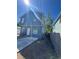 Exterior rear view of the two-story home featuring blue siding and backyard at 2527 13Th S Ave, St Petersburg, FL 33701