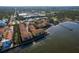 Picturesque condo complex aerial view of its ideal location, serene waterfront, and nearby amenities at 264 Seagate Ct, Dunedin, FL 34698