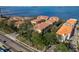Stunning aerial view of waterfront condo community featuring lush landscaping and beautiful bay views at 264 Seagate Ct, Dunedin, FL 34698