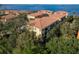 A scenic aerial view of townhomes nestled among lush greenery, near the waterfront at 264 Seagate Ct, Dunedin, FL 34698