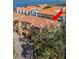 Aerial view of a condo building featuring a terra cotta tile roof and lush landscaping at 264 Seagate Ct, Dunedin, FL 34698