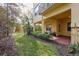 Spacious back porch offering access to a well-maintained backyard and greenery at 264 Seagate Ct, Dunedin, FL 34698